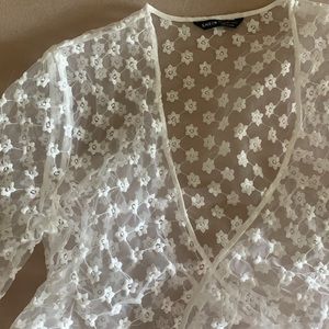 Sheer tie front shirt. Flower print. Size large.